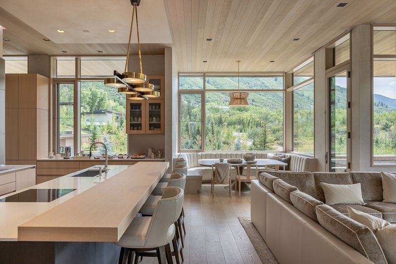 Layered Lighting With Iron And Rattan Fixtures