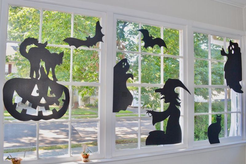 Black Cat Silhouettes In Window Corners