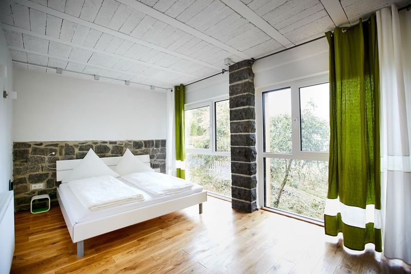 8 Portland Loft Bedrooms That Embrace Arches And Stone Elegance - Decor Hint Volcanic Basalt Feature