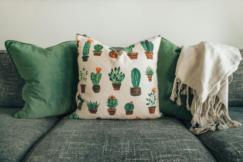 11 Common Design Choices That Can Shrink Your Small Living Room - Decor Hint Excessive Throw Pillows Consume Space