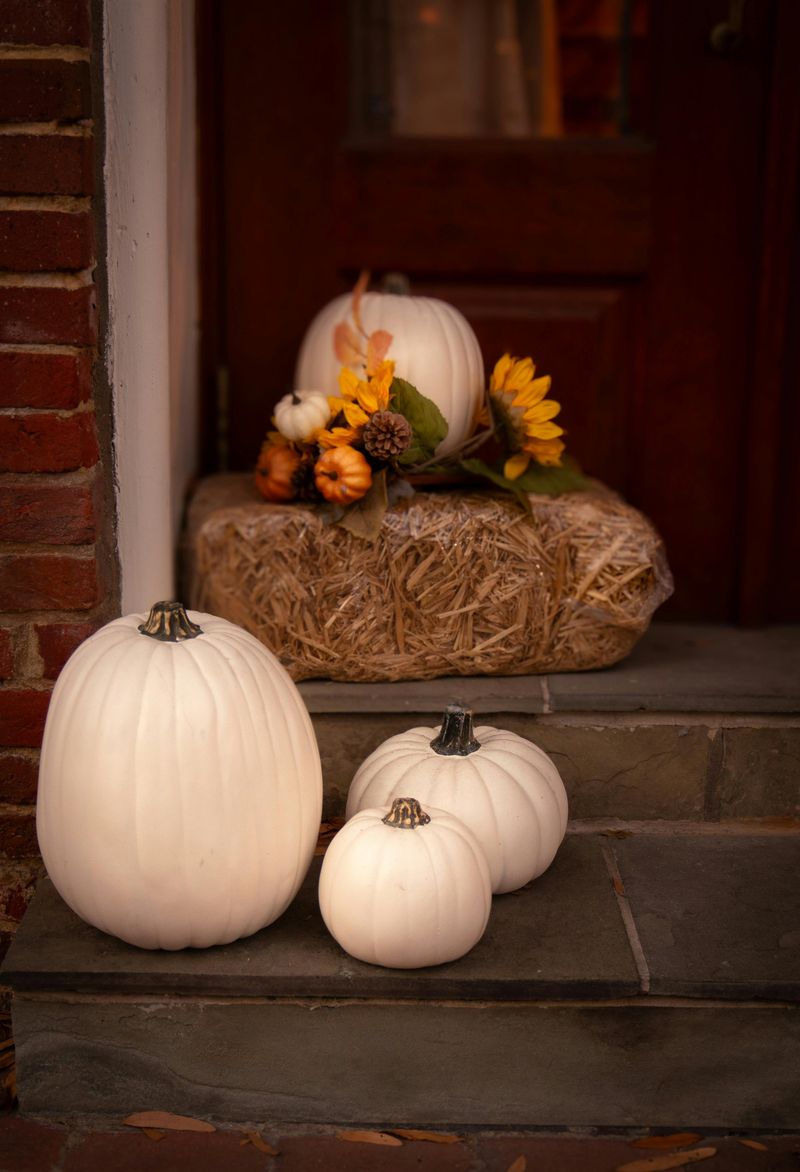10 Porch Pumpkin Arrangements That Feel Classic Not Cheesy - Decor Hint Whitewashed Pumpkins with Greenery