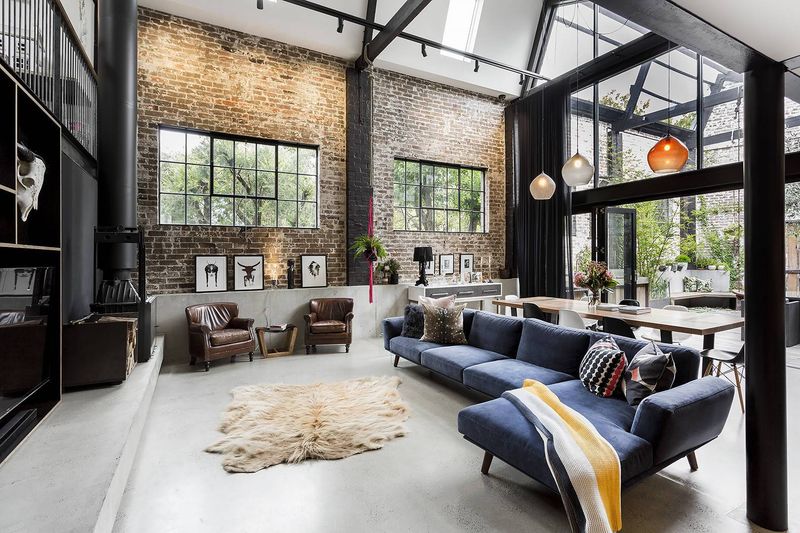 Concrete Floors With Cozy Layered Rugs