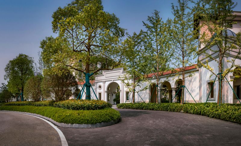 Curved Driveway With Layered Planting