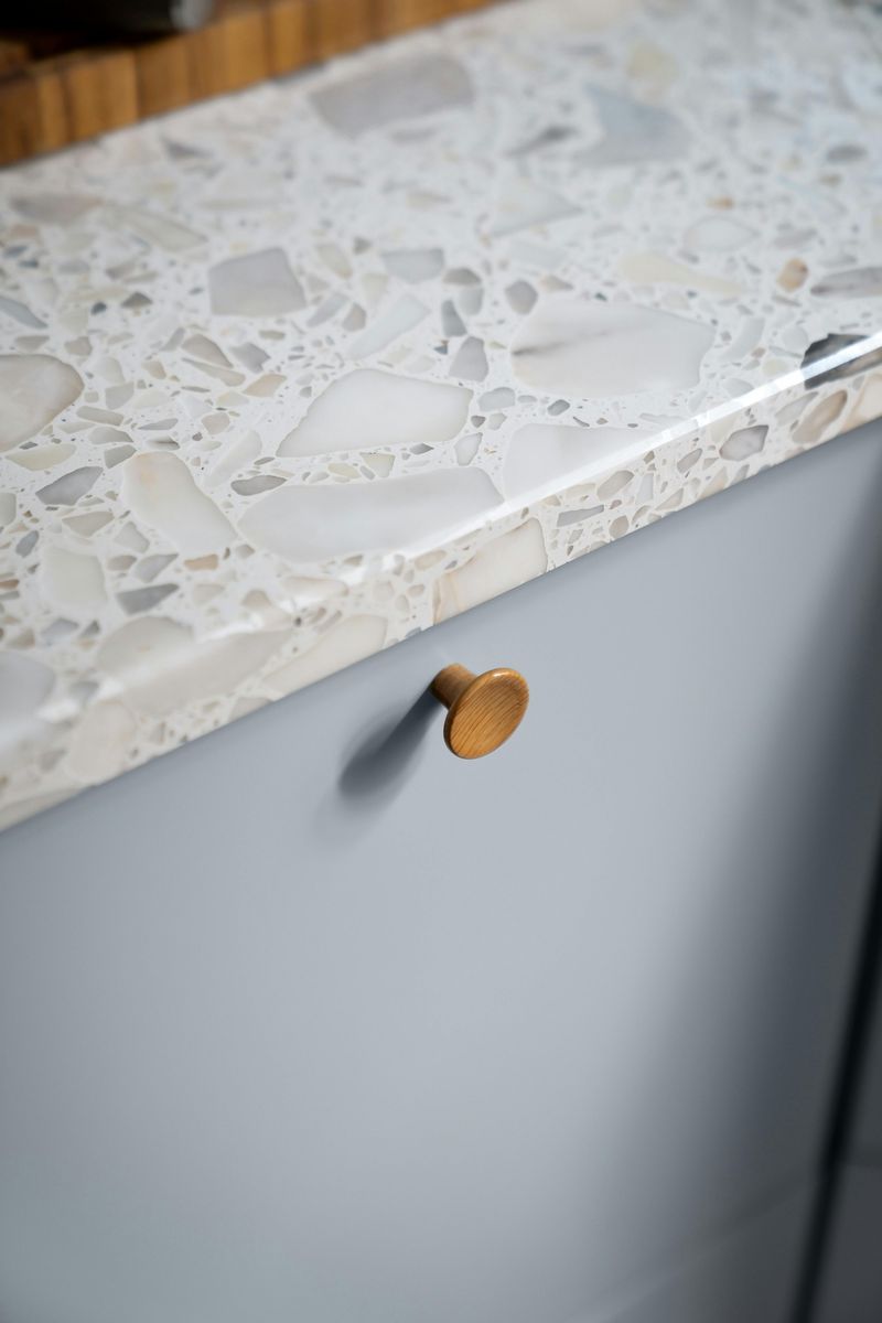 12 Concrete Counter Ideas That May Be Just What Your Kitchen Needs - Decor Hint Concrete with embedded stones for texture