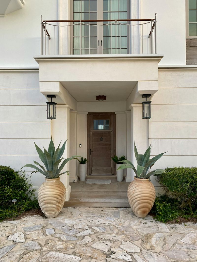Staged Entryway With Updated Doormat And Lighting