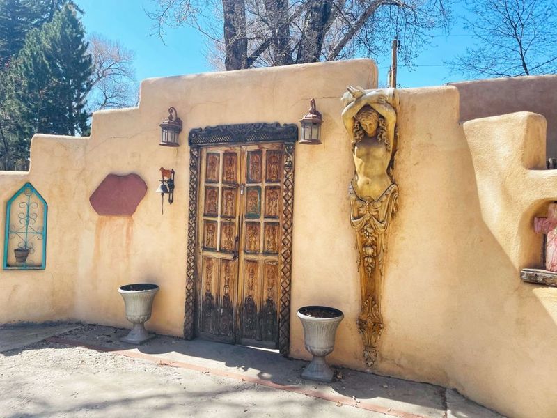 12 New Mexico Pueblo-Style Homes Straight Out Of A Storybook - Decor Hint Carved Wooden Door Entrance