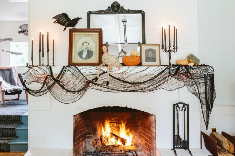 Black Candlesticks And Vintage Mirrors
