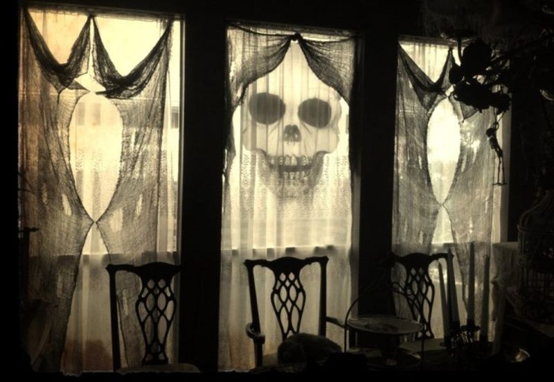 Ghostly Figure Illuminated Windows