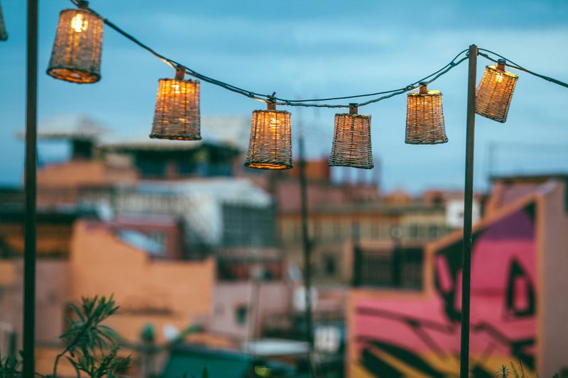 Patio Decorating Ideas That Could Work On A Modest Budget - Decor Hint Installing Affordable String Lights Or Lanterns