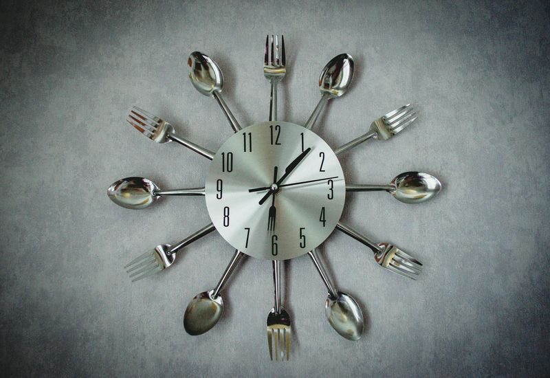 9 Kitchen Tweaks That Could Bring Midcentury Modern Vibes - Decor Hint Statement Clock or Wall Art
