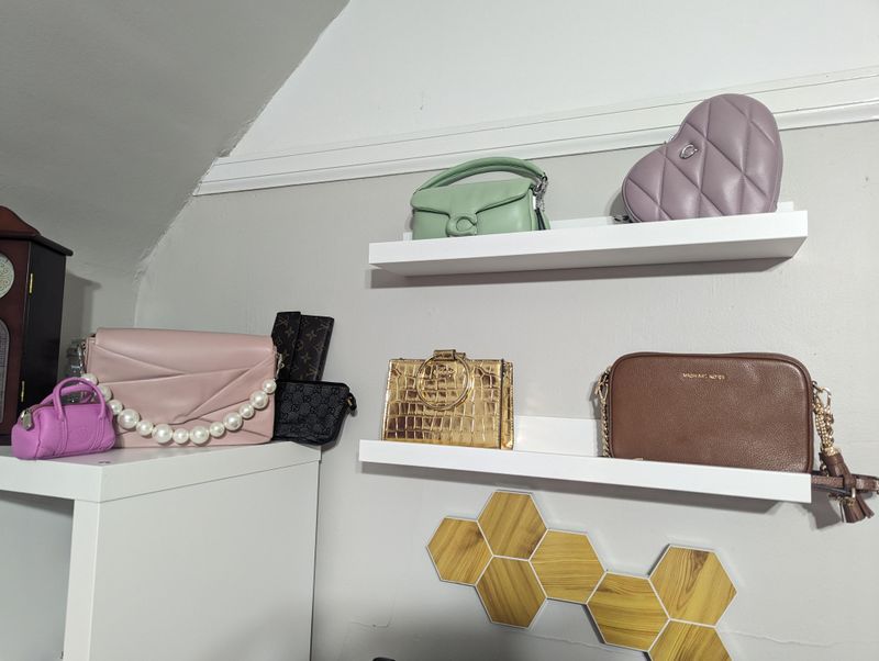 Designer Handbags On Floating Shelves