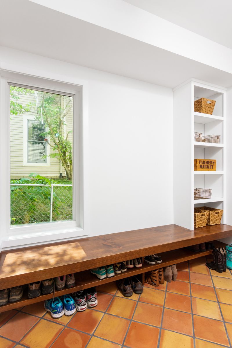 Walnut Benches And Terracotta Tile Bring Earthy Warmth 