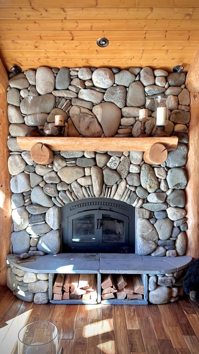 Stacked River Rock Mantel With Wood Ledge