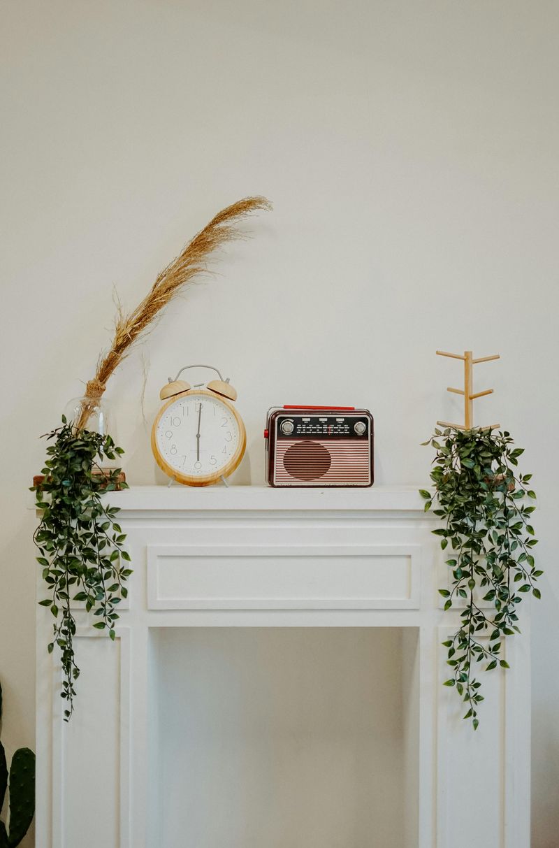 Mantel With Layered Art And Fall-Themed Prints