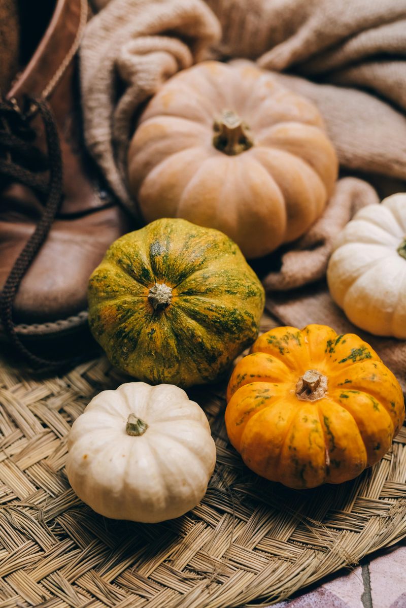 10 Porch Pumpkin Arrangements That Feel Classic Not Cheesy - Decor Hint Mixed-Sized Natural Pumpkins