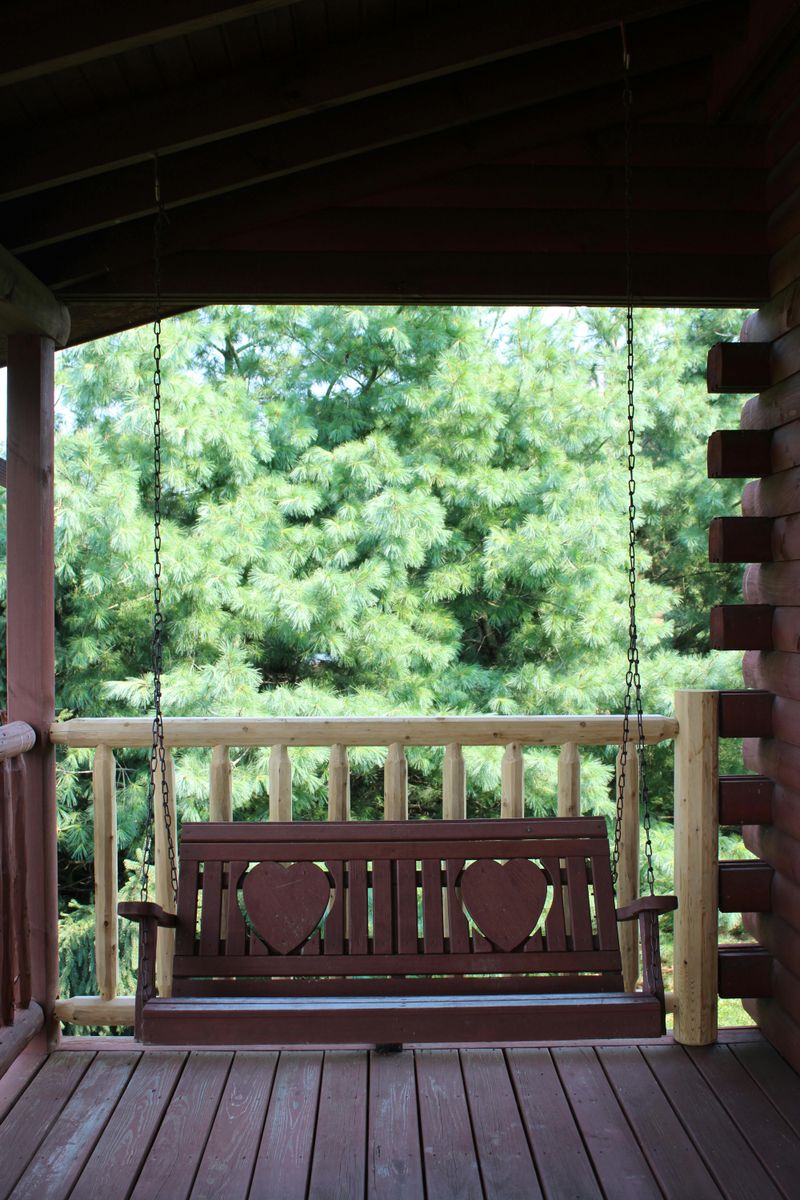 5 Porch Rocking Chair Setups That Capture Fall Afternoons - Decor Hint Swinging Rocker Bench with Autumn Wreath