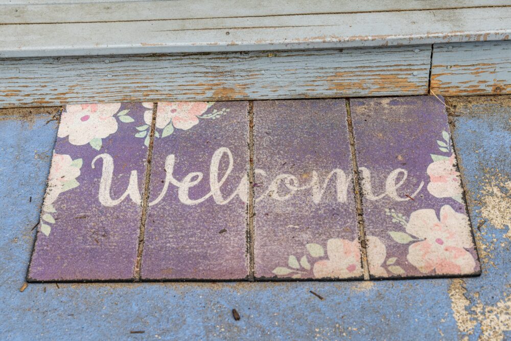 Worn Welcome Mats Or Entryway Rugs