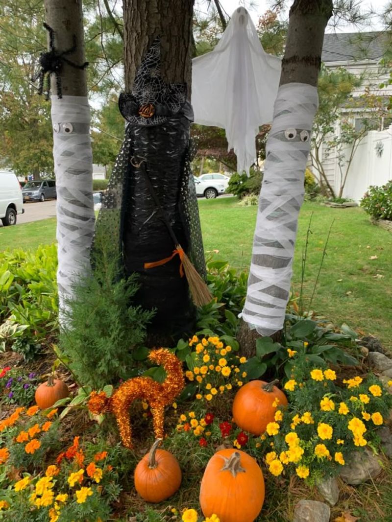 Massachusetts Celebrates With 19 Magical Halloween Displays Neighbors Love - Decor Hint Mummy-Wrapped Trees And Posts