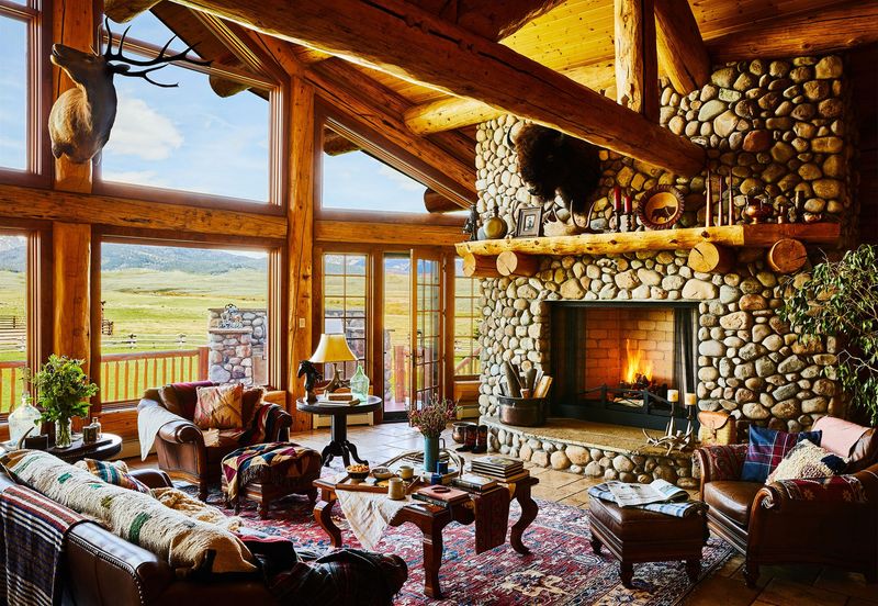 The Worn Leather Armchairs In Montana Homes That Locals Swear Never Go Out Of Style - Decor Hint Timber Frame Retreats With Oversized Leather Armchairs