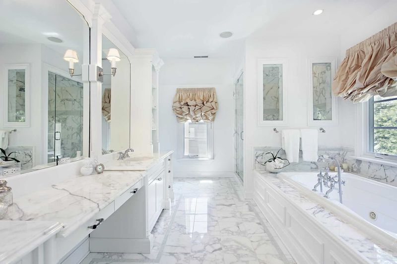 11 Florida Bathroom Remodels Homeowners Wish They'd Skipped - Decor Hint All-White Minimalist Remodel