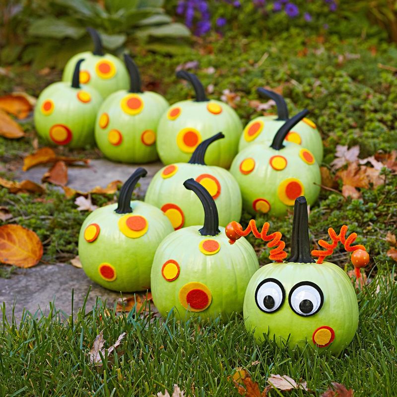 Painted Pumpkins With Intricate Designs As Table Centerpieces
