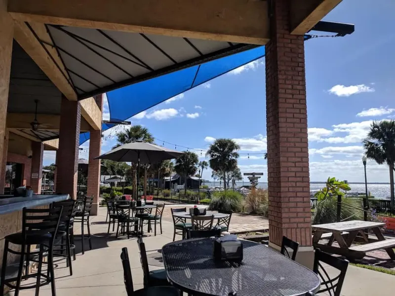 Where Flavor Meets The Lake: 19 Must-Try Florida Waterfront Restaurants - Decor Hint Puddle Jumpers Lakeside Grill & Bar, Tavares