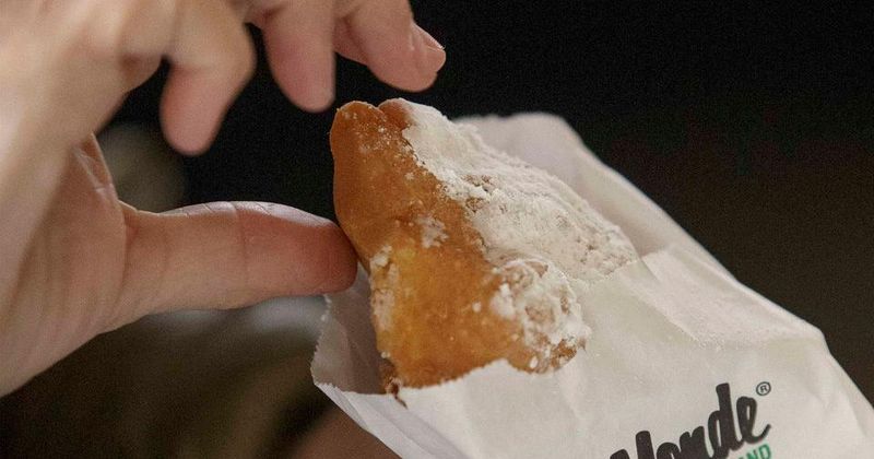 This Iconic Louisiana Café Serves Beignets Worth The Road Trip - Decor Hint How It Compares To The French Quarter Location