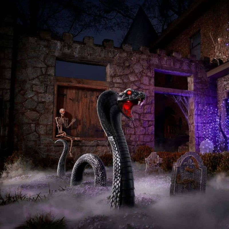 Texas Homeowners Go All Out With These Creepy Yard Displays - Decor Hint Giant Serpent Attack