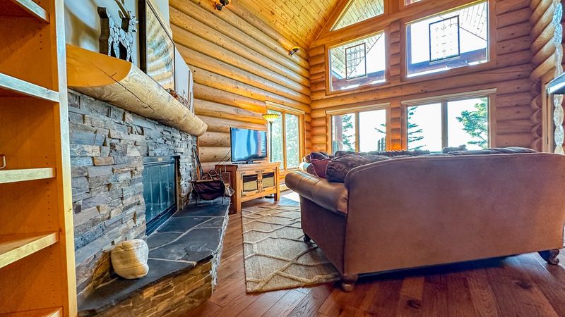 Oversized Windows Framing Snowy Views