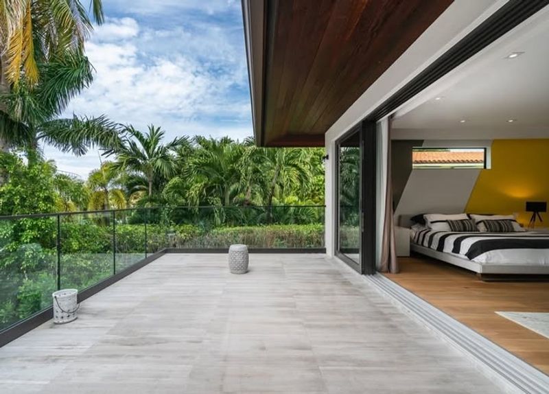 13 Miami Bedroom Trends That Prove Bold And Breezy Is Back For 2026 - Decor Hint Sliding Glass Doors to Outdoor Spaces