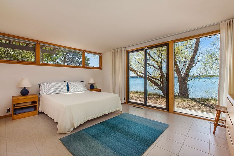 Michigan Lake House Bedrooms Perfect For Snuggling Up Lakeside - Decor Hint Architect's Glass Cube on Mullett Lake