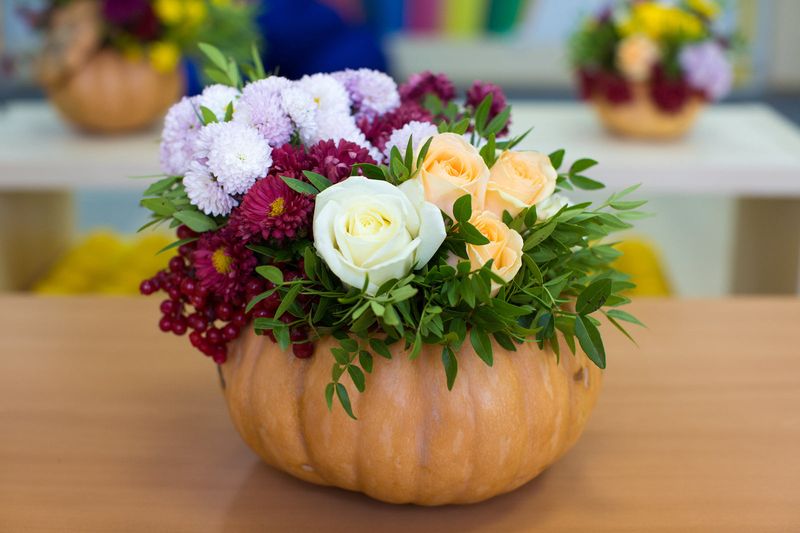 Pumpkin Planters With Fall Flowers Spilling Out
