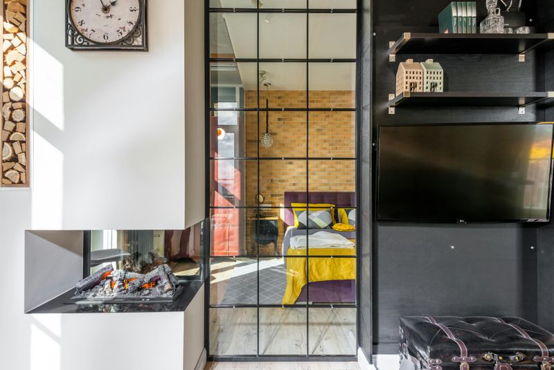 Things Designers Want You To Know Before Hanging A TV Over Your Fireplace - Decor Hint Resale Value Concerns for Future Buyers