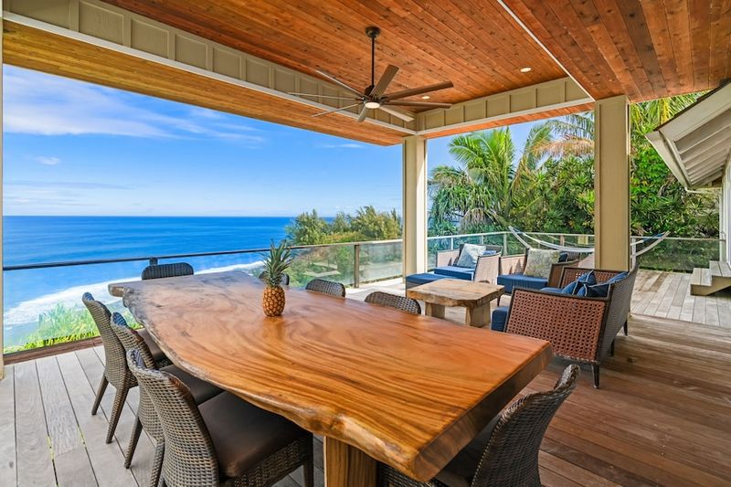 Hanging Egg Chairs On Wooden Lanais