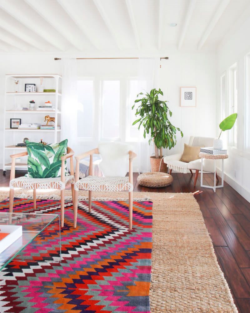 Bold Maximalist Decor Ideas That'll Make Your California Home Pop Without The Chaos - Decor Hint Layer Multiple Rugs for Texture and Color