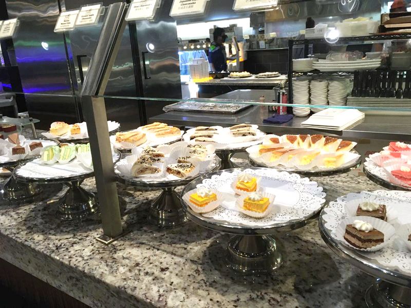Dessert Station Featuring Cakes, Ice Cream, And Pastries