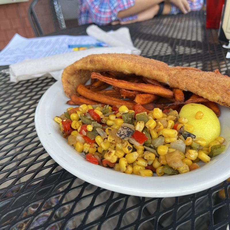 20 Massive Pork Tenderloin Sandwiches In New England You'll Need Two Hands To Tackle - Decor Hint The Moosehead Mauler at Wilderness Café - Greenville, Maine