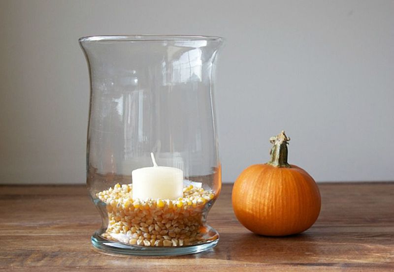 Glass Hurricane With Corn Kernels And Candles