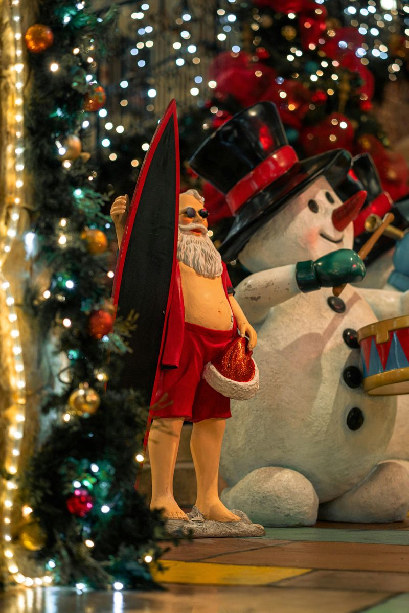California Beach-Inspired Christmas Décor Ideas Full Of Breezy Magic - Decor Hint Surfboard Santa Display