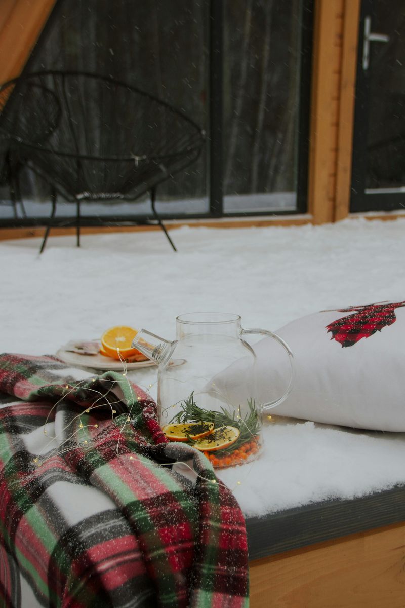 17 Porch Décor Tips That Bring Big Warmth To Colorado Homes In Winter - Decor Hint Plaid Blankets Draped Over Seating