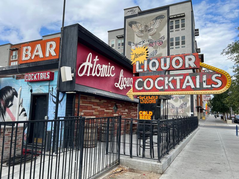 18 Wonderfully Weird Roadside Attractions In Nevada You Need To See To Believe - Decor Hint Atomic Liquors Sign