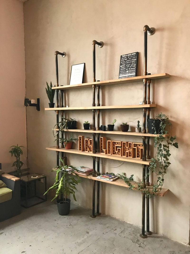 12 Tired California Living Room Trends Designers Say It's Time To Let Go - Decor Hint Industrial Pipe Shelving