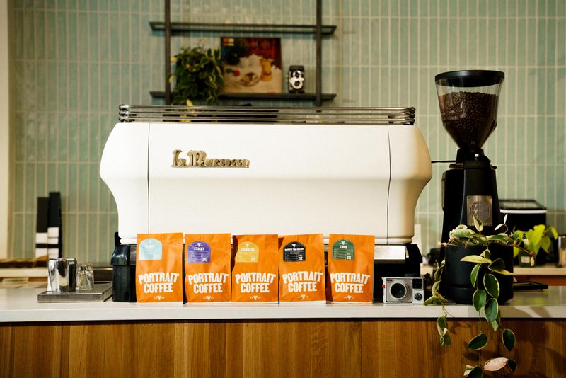 15 Feel-Good Cafés Across Georgia Where Cozy Vibes And Kittens Steal The Show - Decor Hint Portrait Coffee