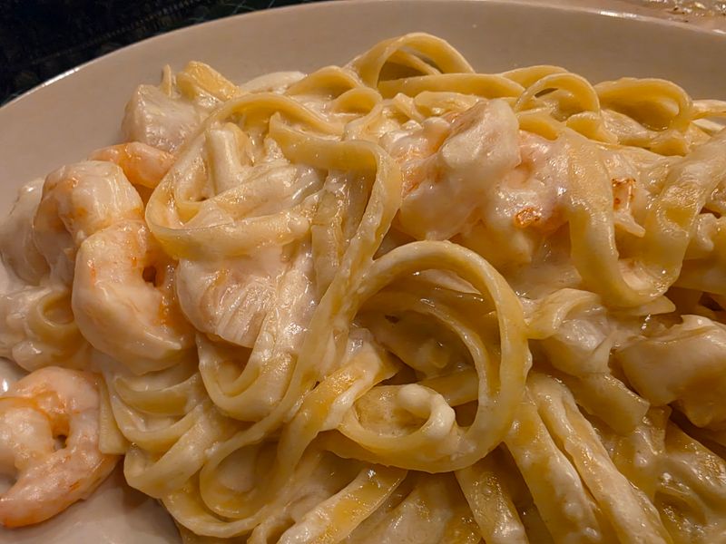 15 Reasons Provino's Italian Restaurant Proves Classic Spaghetti Never Goes Out Of Style In Georgia - Decor Hint Generous Portions That Feed The Whole Table