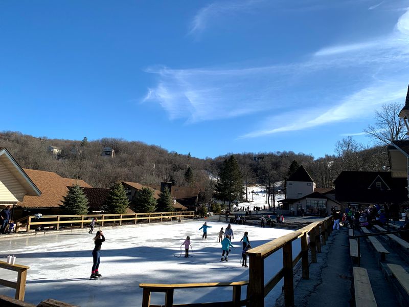 Ice Skating Under The Mountain Sky