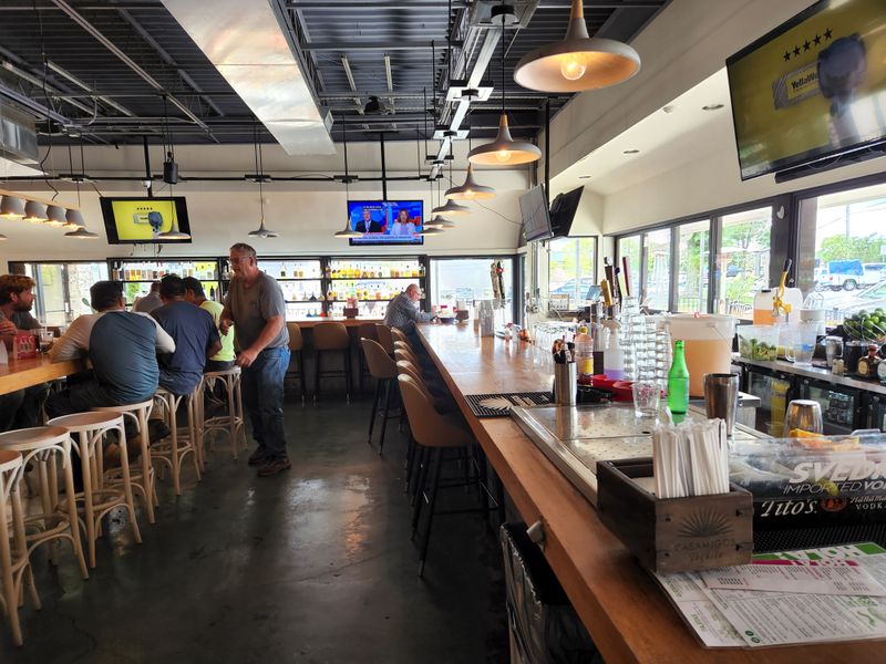 Vibrant Bar Scene With Craft Margaritas