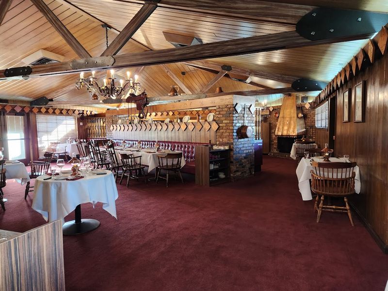 This California Spot Is Hiding The State's Juiciest Steaks - Decor Hint Cozy Western Ambiance With Warm Wood And Red Carpeting