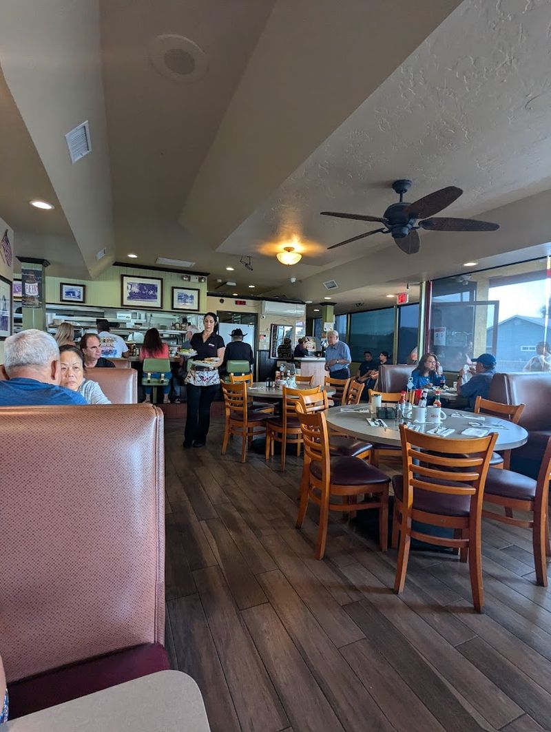 Green Leather Stools And Brown Booths