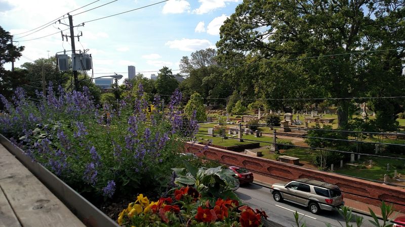 A Rooftop Deck With Views Of The Atlanta Skyline