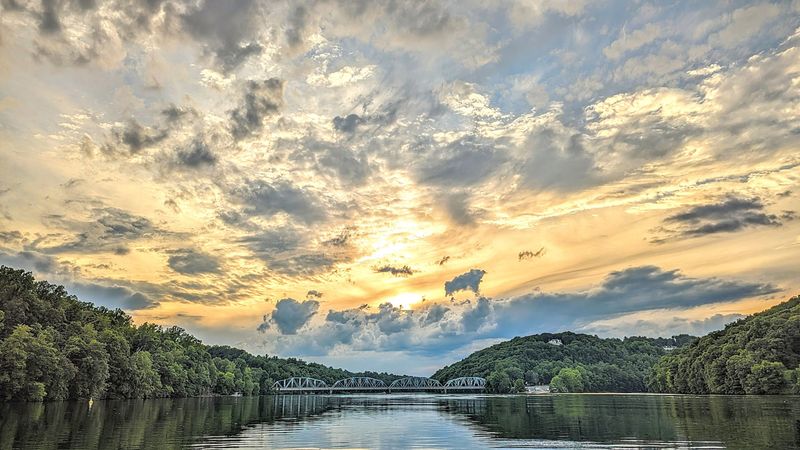 Witness Golden Sunsets Over A Wide, Tranquil Lake